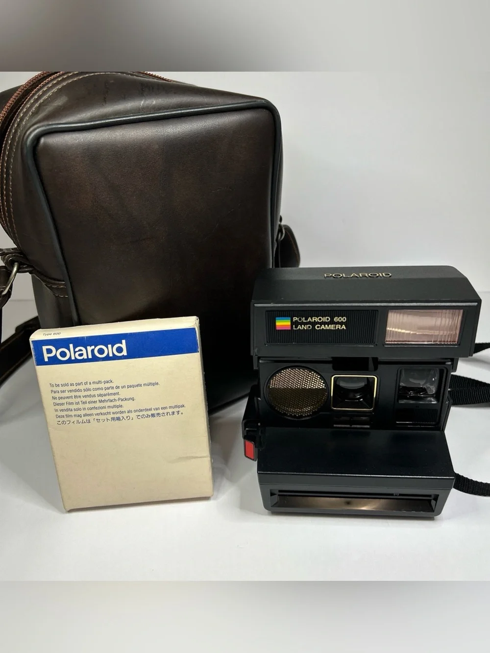 Vintage Polaroid 600 instant camera with case and film